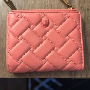 Kurt Geiger wallet light pink in color
